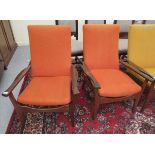 A pair of 1970s teak easy chairs, upholstered in orange coloured fabric with swept open arms,