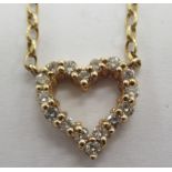 A 9ct gold and diamond set open heart pendant,