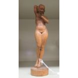 A 20thC carved light oak figure,