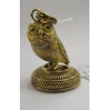A gilded document seal, in the form of an owl,