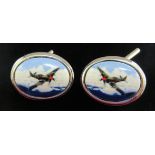 A pair of silver and enamelled cufflinks,