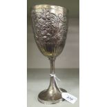 A silver trophy cup with embossed and chased decoration,