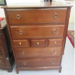 A Stag mahogany dressing chest with an arrangement of seven drawers,