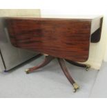 An early 19thC mahogany Pembroke table,