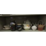 Domestic ceramics: to include a cream glazed twin handles,