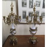 A pair of modern 'antique' inspired cast brass five branch candelabra,