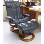 A Stressless Ekornes easy chair, upholstered in green hide, on a splayed,