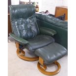 A Stressless Ekornes easy chair, upholstered in green hide, on a splayed,