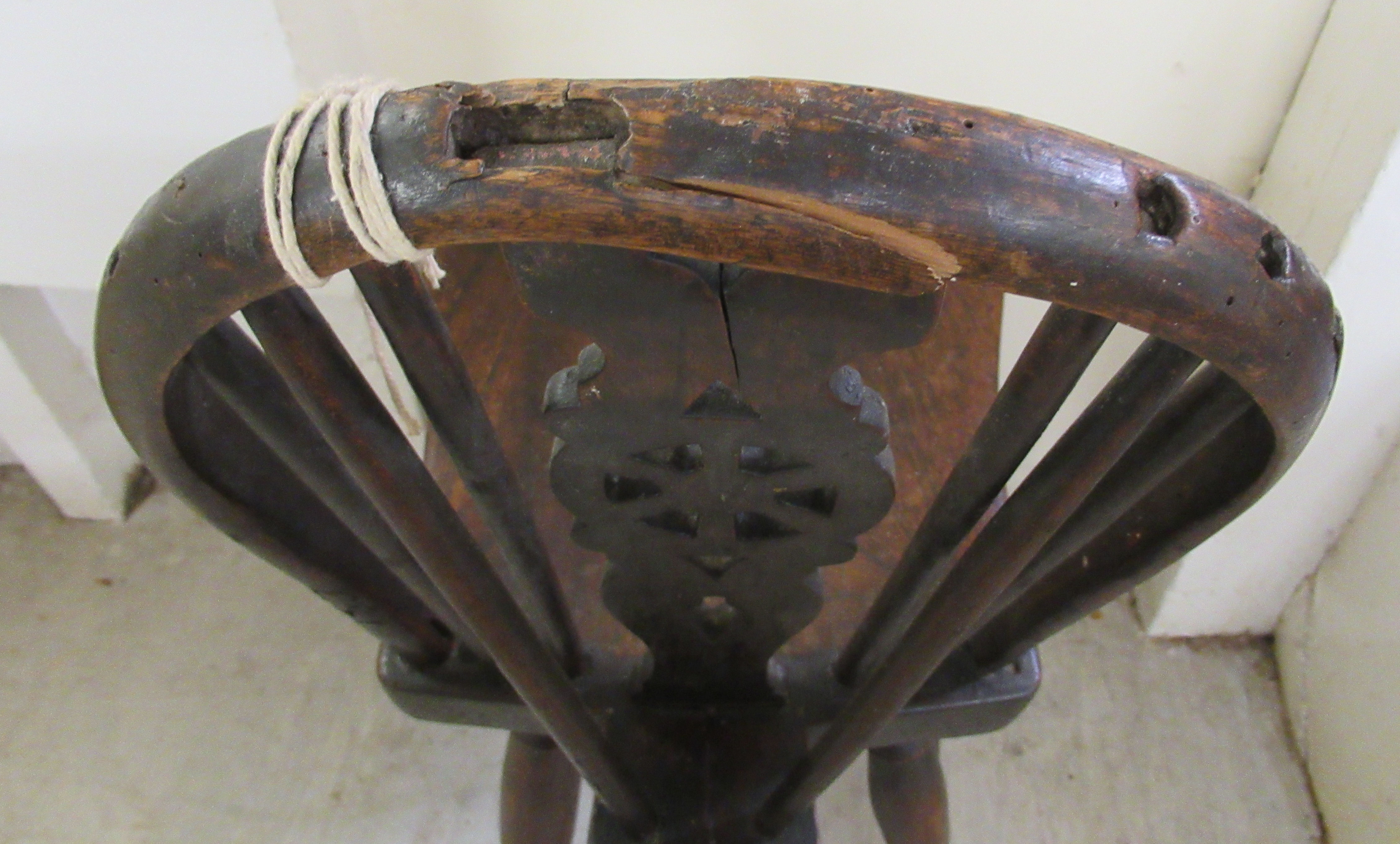 A child's late 18thC elm and ash chair with a Windsor design wheel carved back and seat, - Image 3 of 3