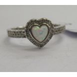 A silver and cubic zirconia and opal set heart shaped ring 11