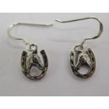 A pair of silver horseshoe design earrings 11