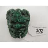 A carved malachite mask belt buckle 11