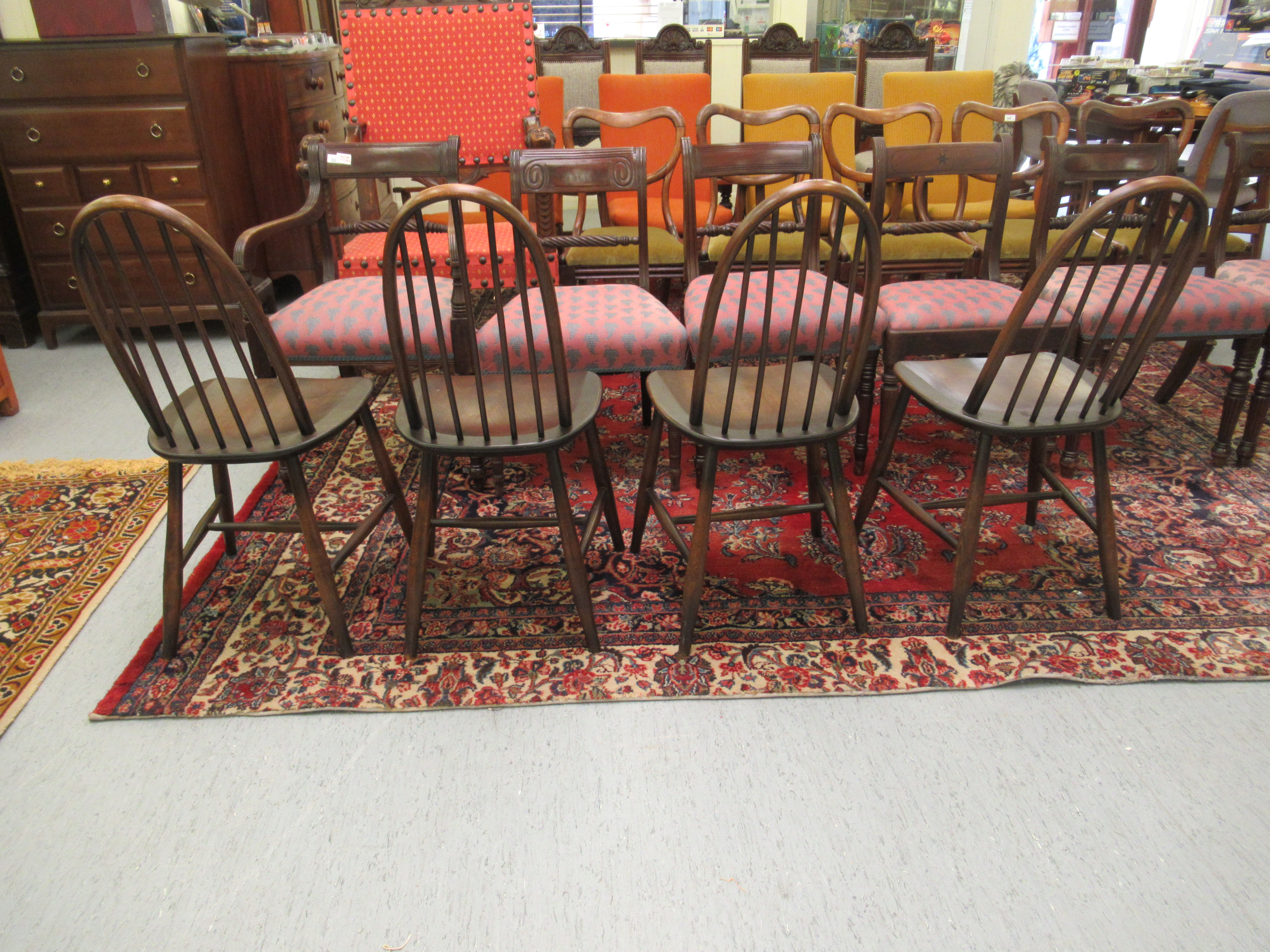 A set of four dark stained Ercol high hoop and spindled back chairs, - Image 2 of 2