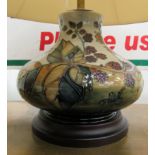 A modern Moorcroft table lamp of squat, bulbous form,