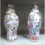 A pair of late 19thC Chinese Canton porcelain vases of cylindrical form, decorated with figures,