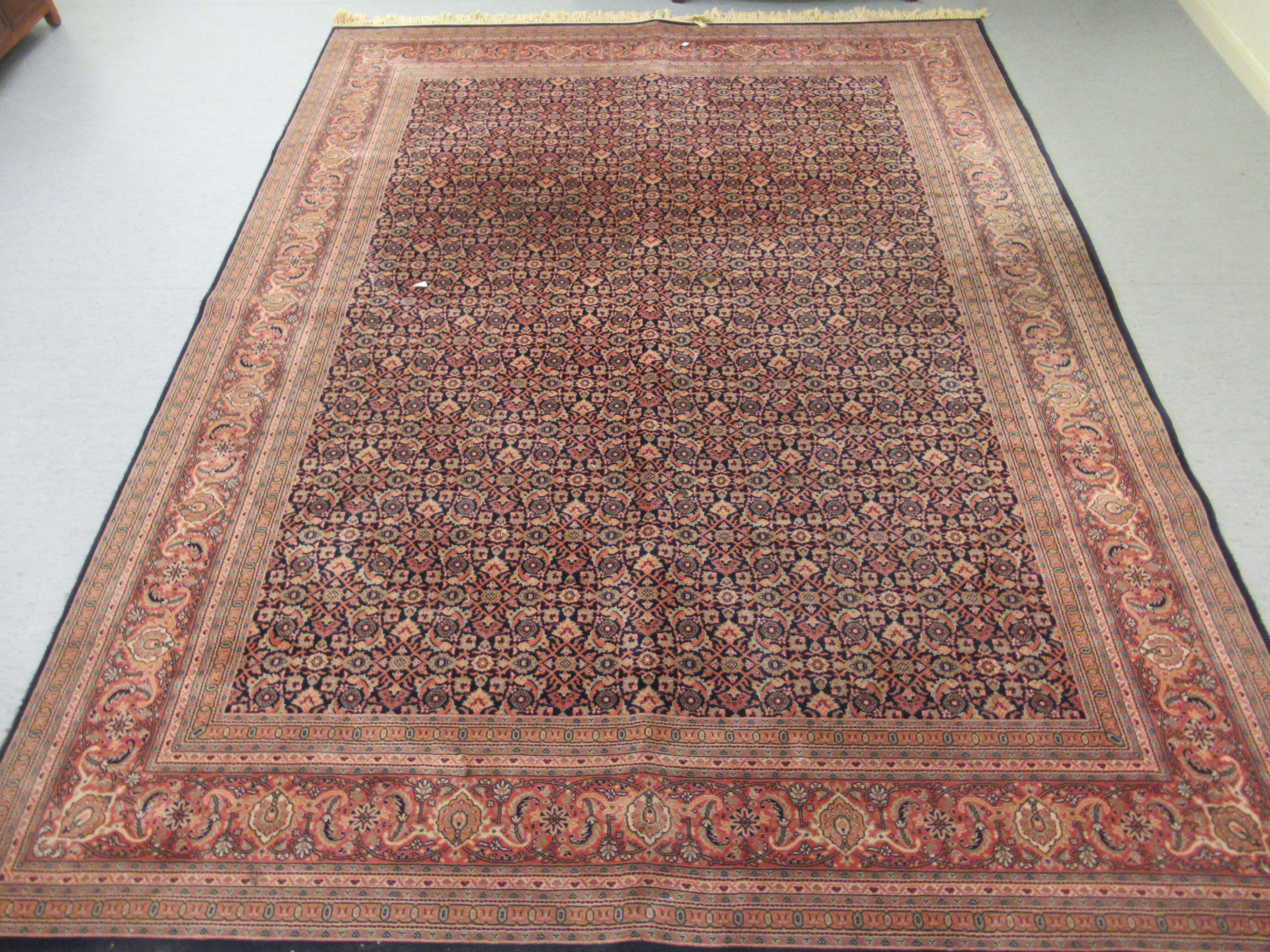 A Persian rug with floral motifs,