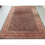 A Persian rug with floral motifs,