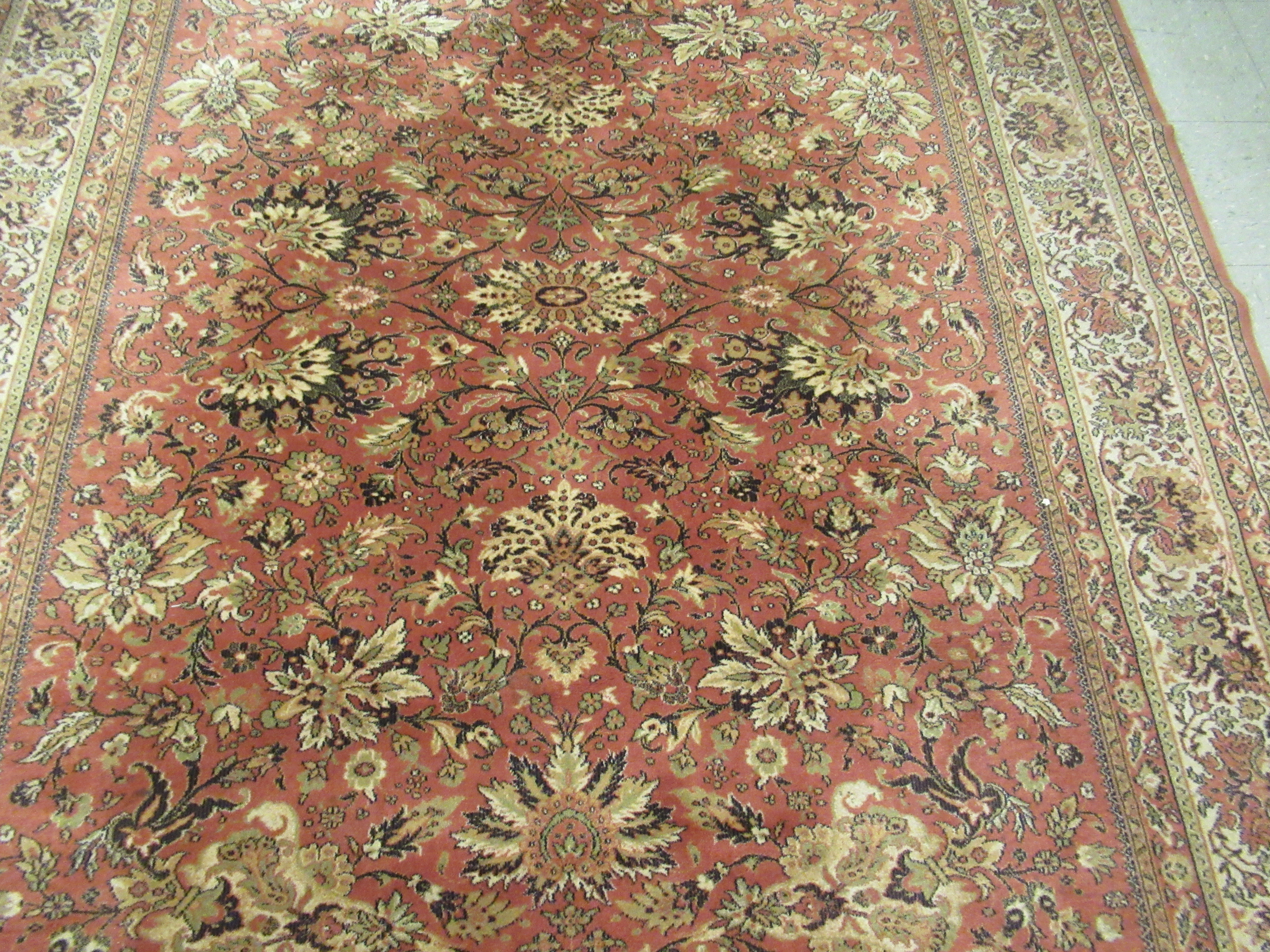 A Belgian rug with floral motifs on an iron red ground 120'' x 78'' LAM - Image 3 of 4
