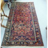 A Persian rug with floral motifs,