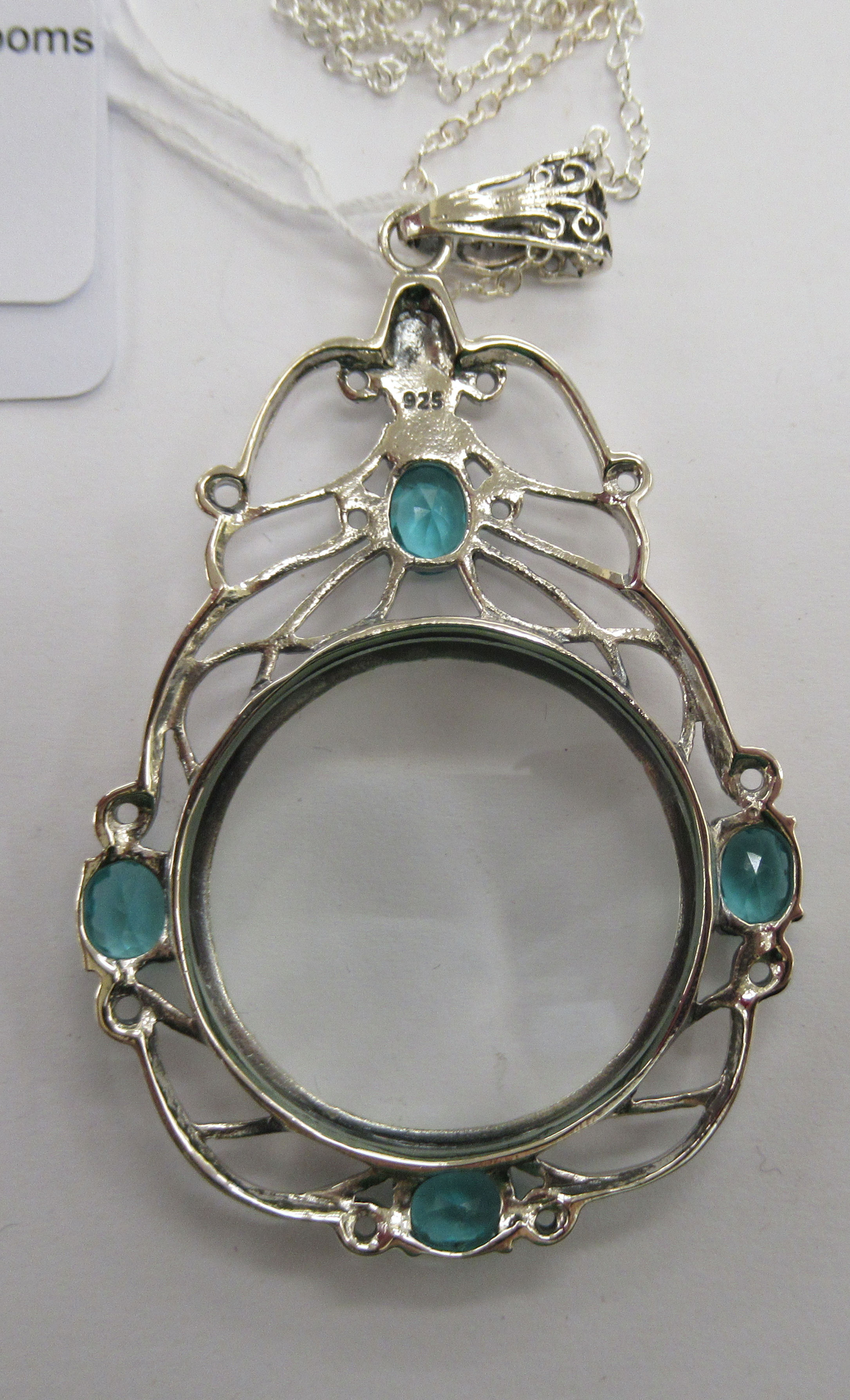 A silver framed magnifying glass pendant, set with blue topaz, - Image 2 of 2