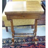 A late Victorian marquetry rosewood games table with a rotating foldover top, enclosing backgammon,