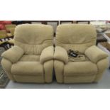 A pair of modern electrically operated recliner armchairs,