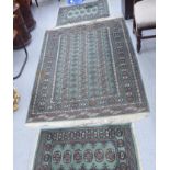 Three similar Bokhara rugs with elephant motifs,