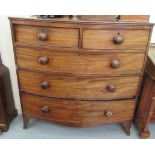 A late Victorian mahogany bow front dressing chest with two short/three long drawers,