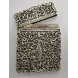 A late 19thC Indian silver coloured metal two part card case,