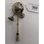 A child's early 20thC silver coloured metal rattle with bells and a whistle CA