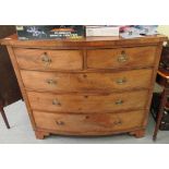 An early 19thC mahogany bow front dressing chest, comprising two short/three graduated long drawers,