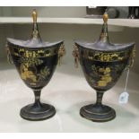 A pair of Regency chinoiserie design cast metal urns and covers,