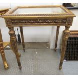 A modern 'antique' inspired giltwood display table, the hinged bevelled glass lid,