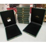 Ten faux green hide jewellery cases with black felt interiors 12''w 15''deep SR