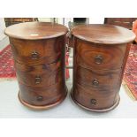 A pair of modern exotic hardwood three drawer pedestal bedside cabinets,