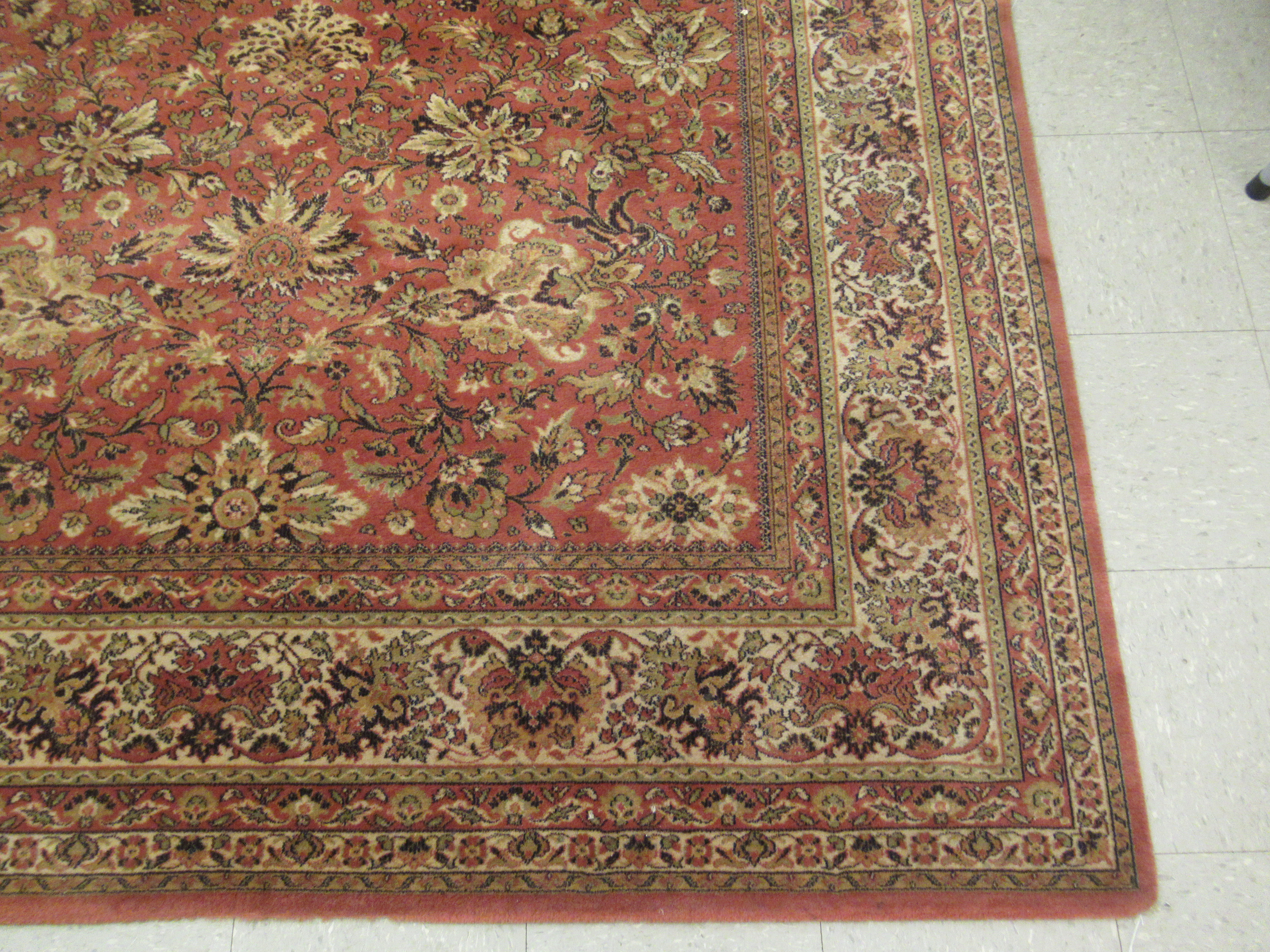 A Belgian rug with floral motifs on an iron red ground 120'' x 78'' LAM - Image 2 of 4