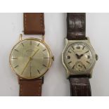 A 1960s Andre-Buchard gold plated and stainless steel wristwatch, faced by a gilded baton dial,