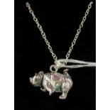 A silver articulated bear pendant,