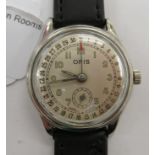 A 1950s Oris stainless steel cased wristwatch with a pointer, faced by an Arabic dial,