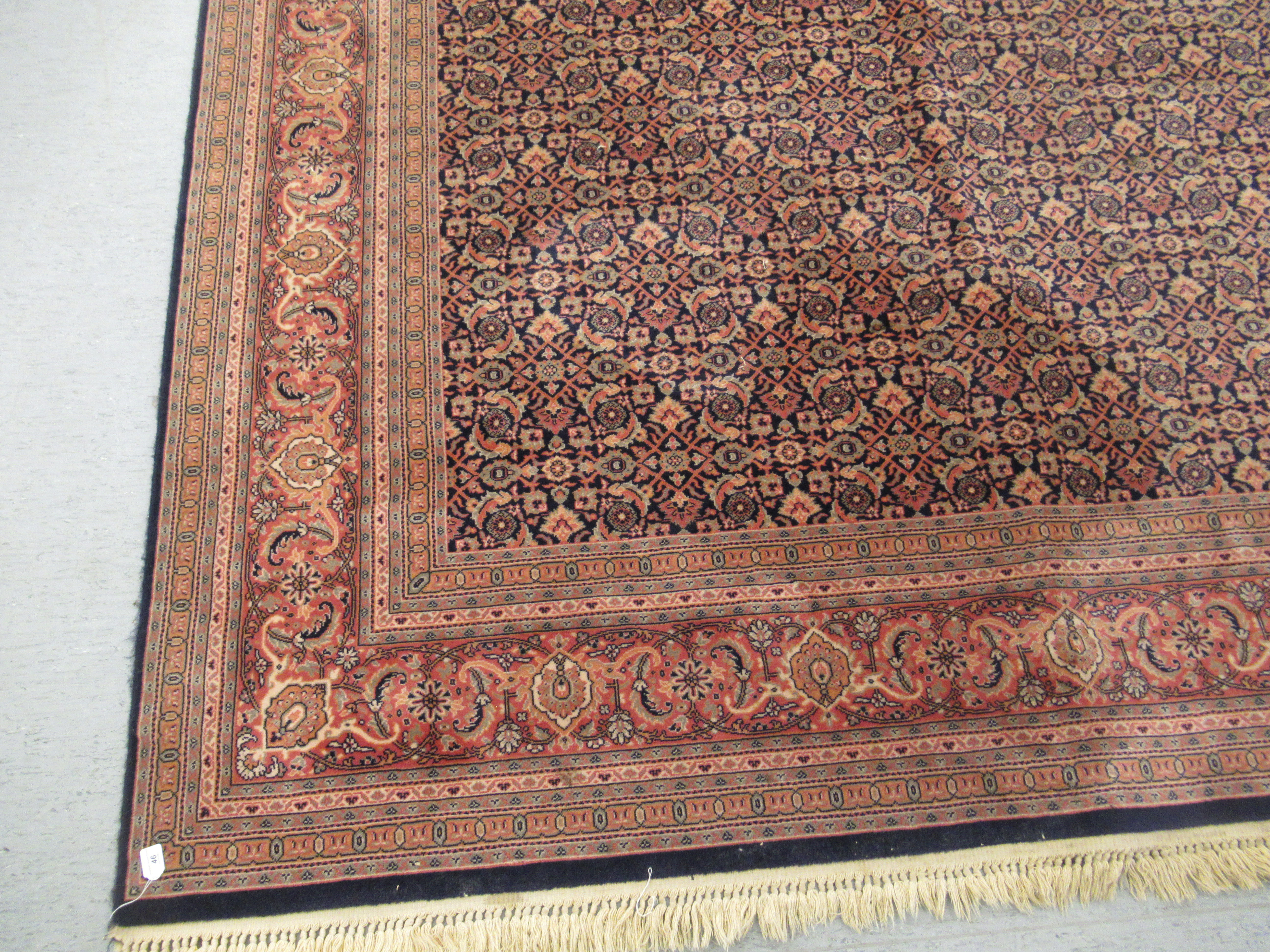 A Persian rug with floral motifs, - Image 2 of 4