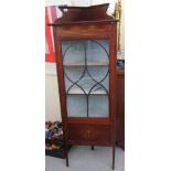 An Edwardian satinwood inlaid mahogany standing corner cabinet with a single lattice glazed door,