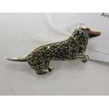 A silver and marcasite brooch,