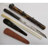 An Asian travellers' metal bound tortoiseshell clad chopstick and knife holder,