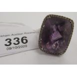 An 18ct white gold diamond and amethyst ring 11