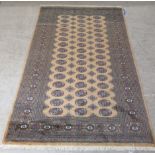 A Bokhara rug, decorated with three columns of sixteen guls,