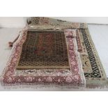 Five small rugs: to include a pair of Bokhara with a central column of seven guls,