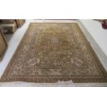 A machine made Indian carpet, profusely decorated with floral and foliate designs,