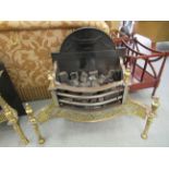 A modern Georgian style freestanding lacquered brass and steel fire basket with an integrated back