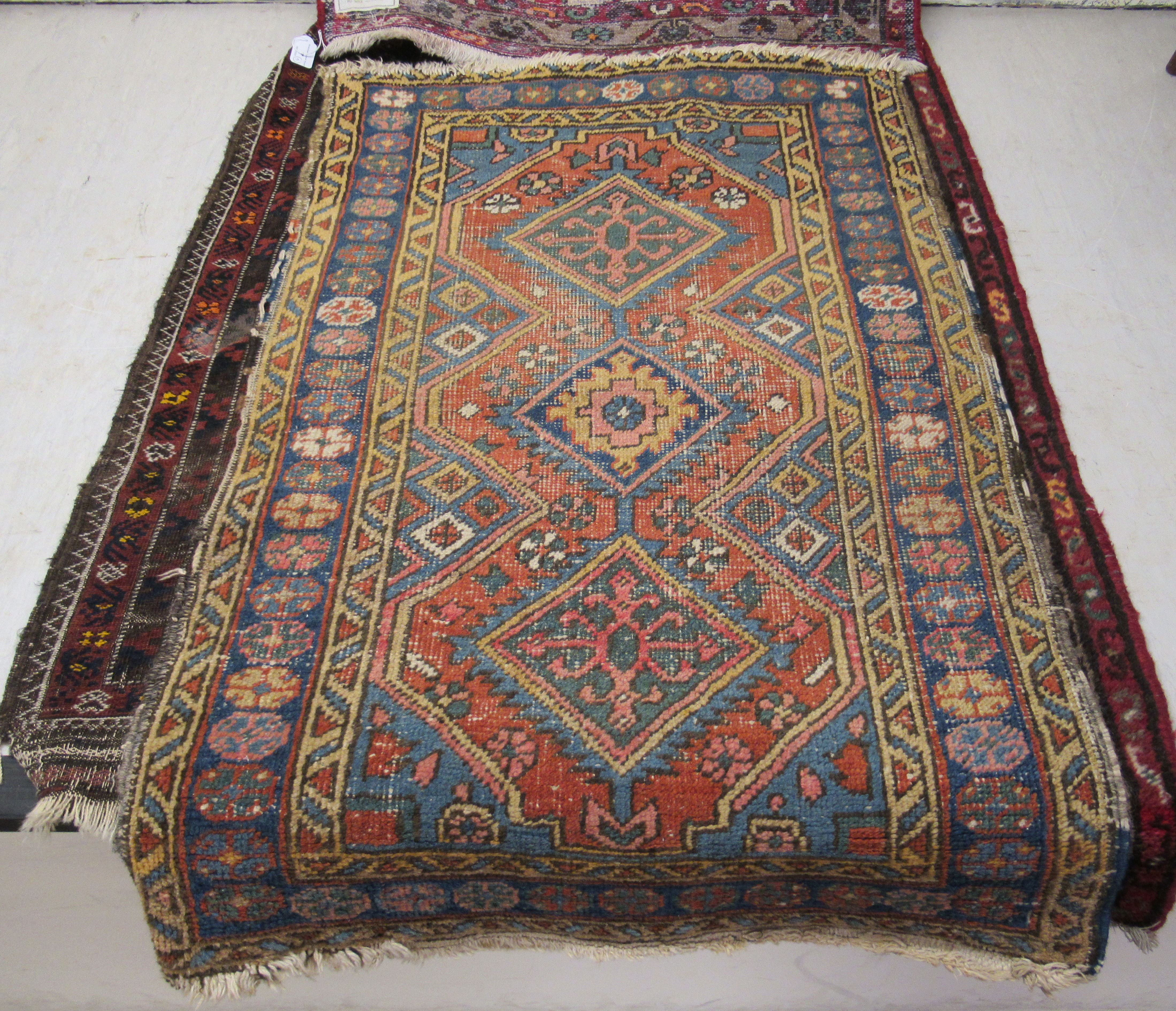 Five small Persian and other rugs, decorated in various styles, - Image 4 of 6