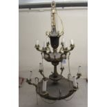 An Empire style part gilt metal, two tier chandelier,